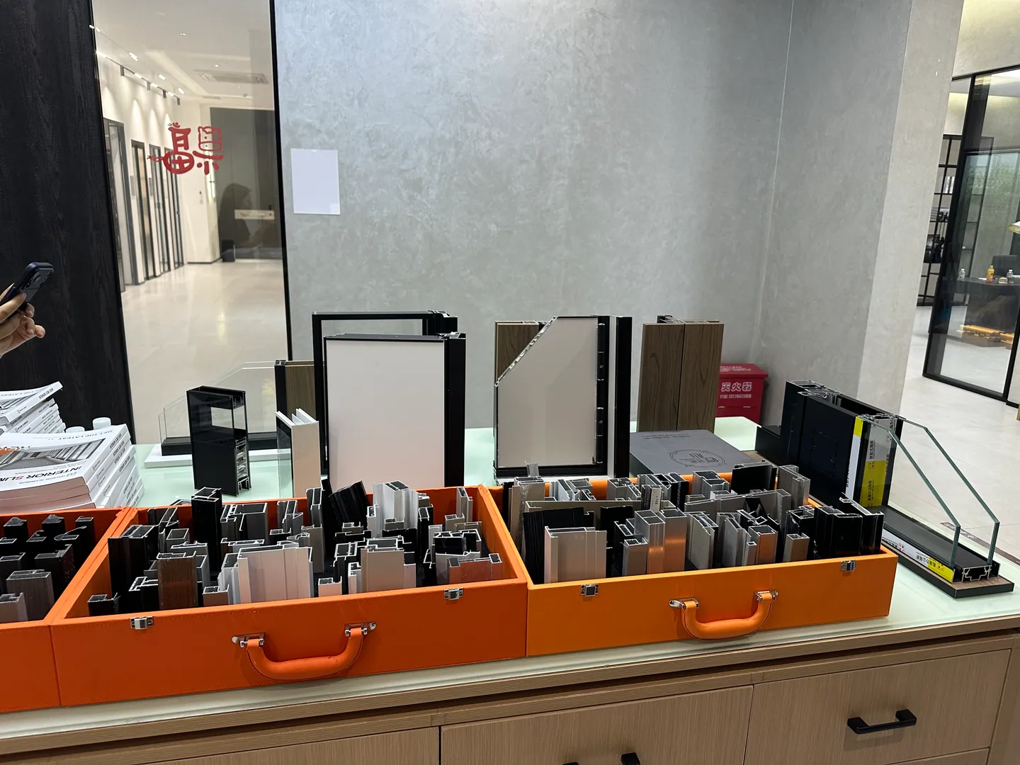 Aluminium profile, finish and hardware samples reviewed during VELA Home Global supplier sourcing in Foshan