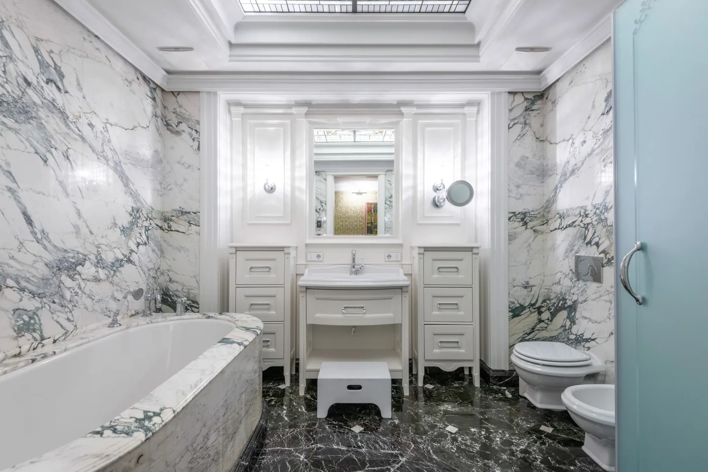 Marble bathroom with sanitary ware, vanity and coordinated bath finishes