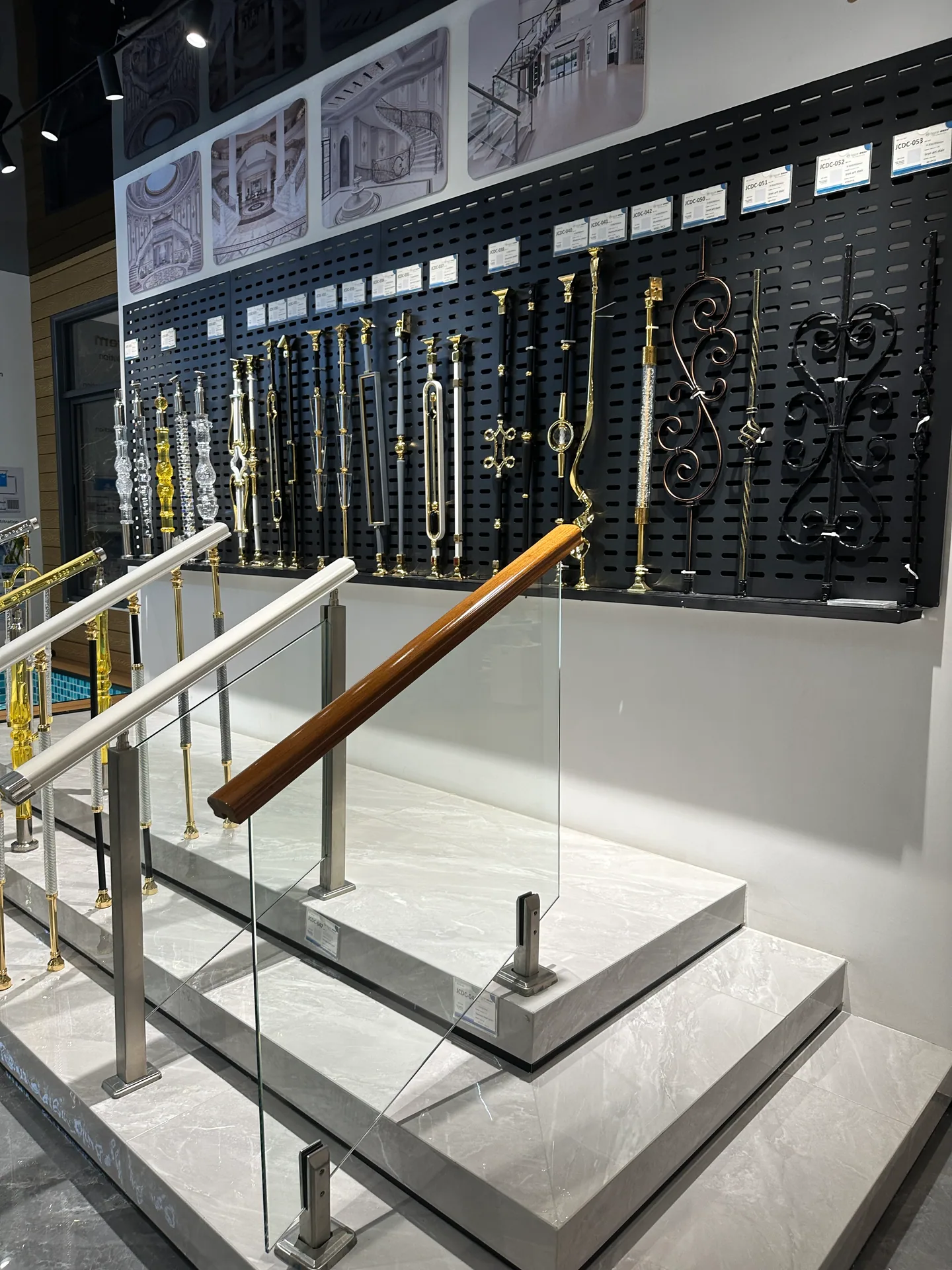 Glass and metal staircase railing sample reviewed in a Foshan showroom