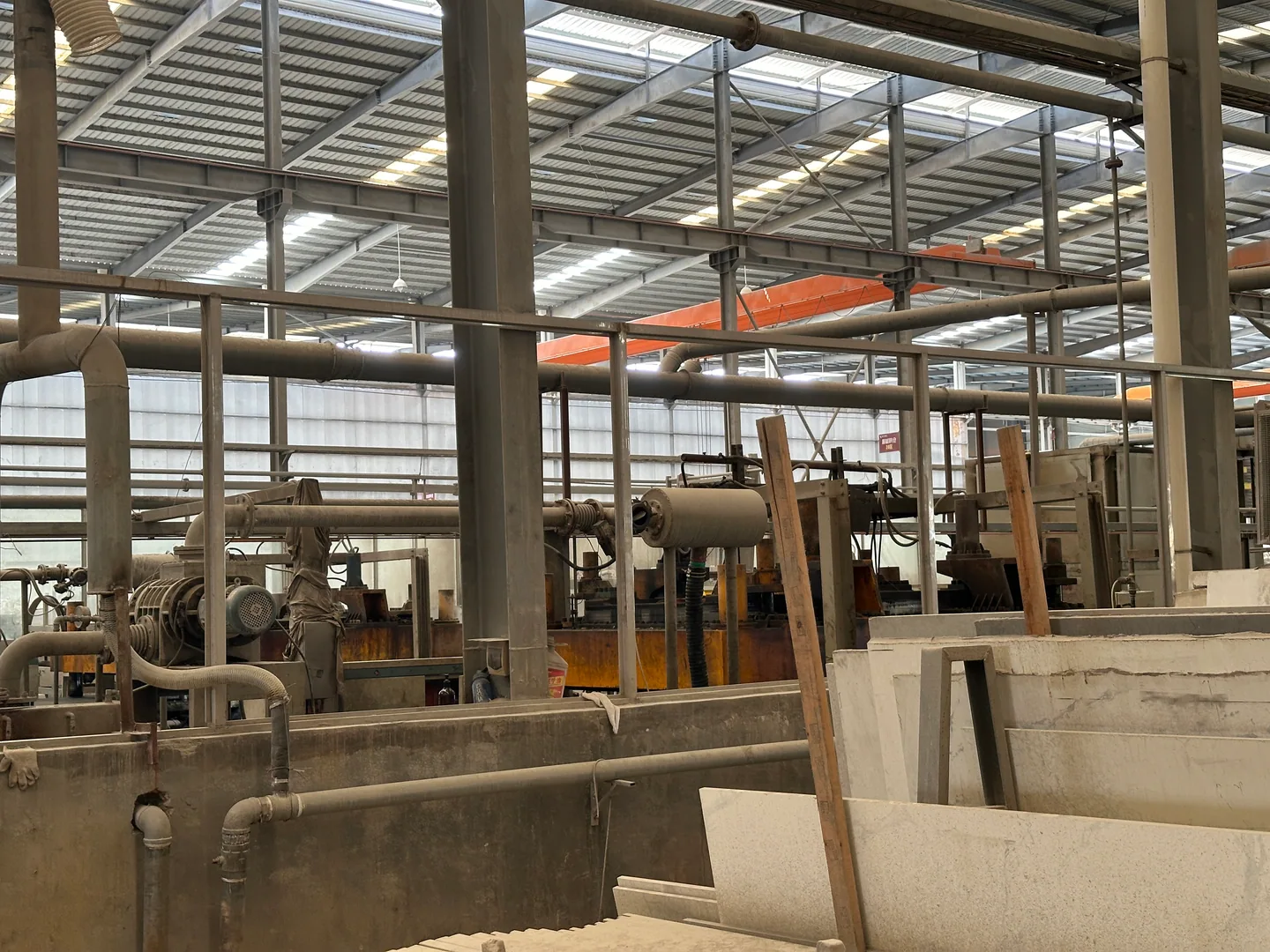 Large stone slabs stored at a Foshan surface factory